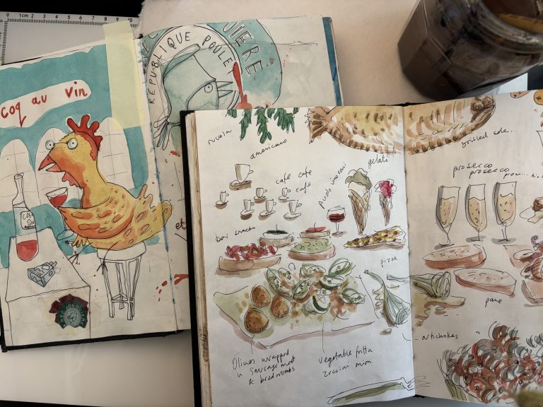 Two overlapping sketchbooks and a pot of murky paint water - sketches include images of a coq au vin a chicken drinking wine and a spread of Italian nibbles. all draing in pen and ink and a bit of watercolour